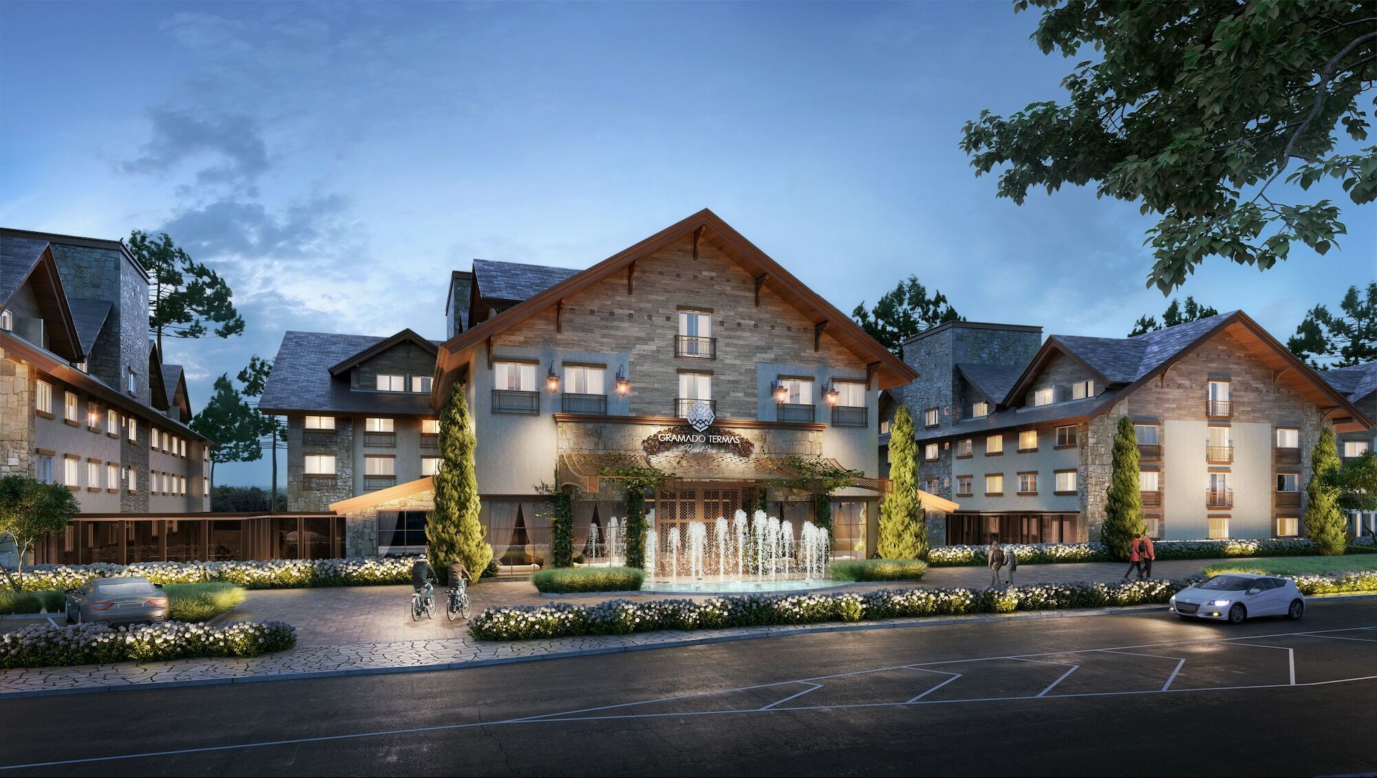 Wyndham Gramado Termas Resort & Spa Exterior foto The image shows a beautiful lodge-style building, likely a hotel or resort. It features a sloped roof with wooden accents and large windows. In front of the building, there is a decorative fountain surrounded by landscaped greenery and flower beds. T